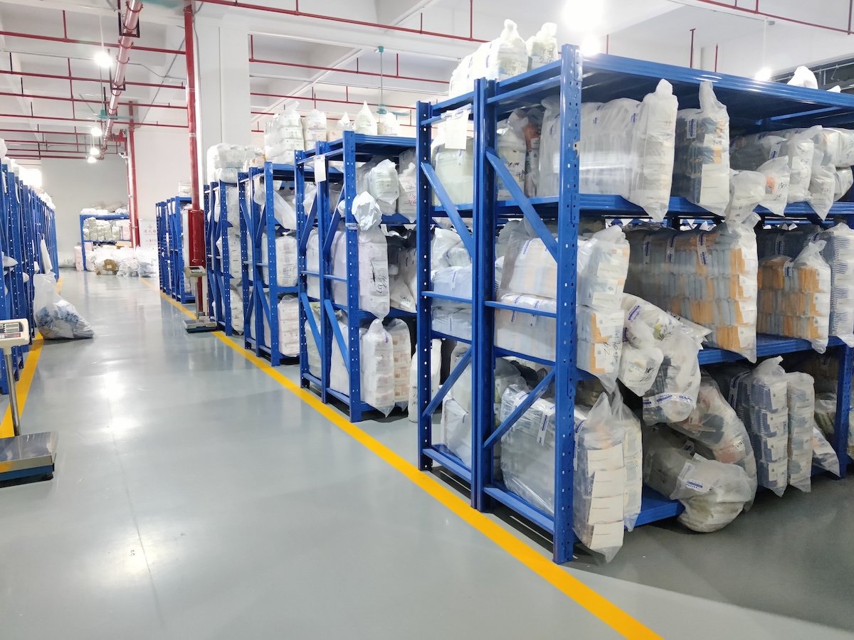 Kids Sleepwear Production & Compliance — Overlock machines sewing sleepwear seams.