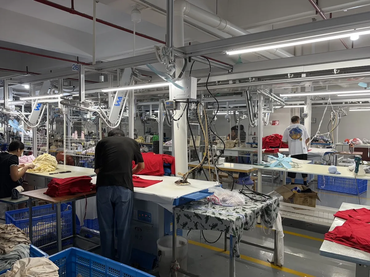 Close-up of an industrial sewing machine producing kids' underwear seams