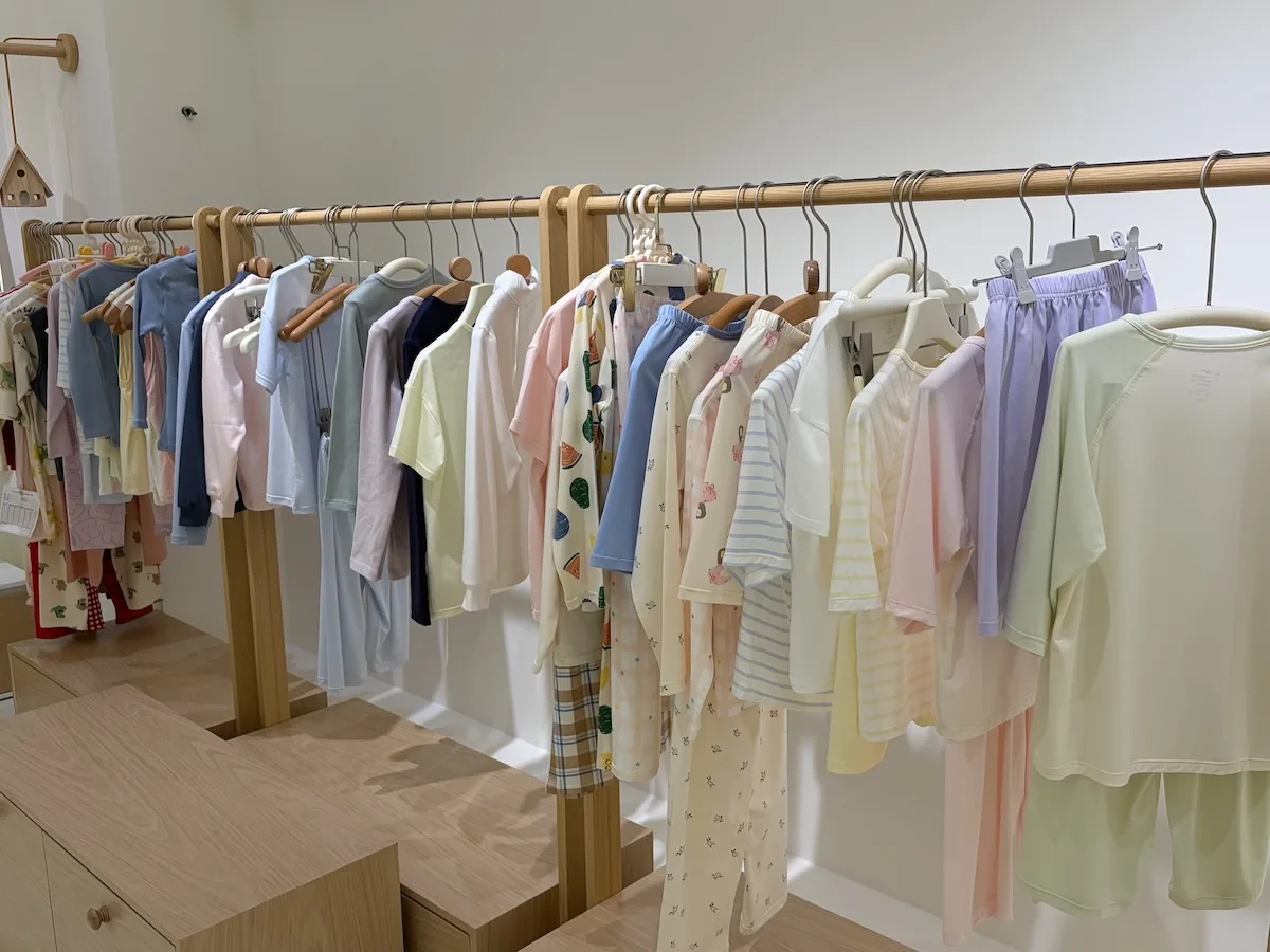 Showroom rack of finished kids' garments made on the shortlisted bases