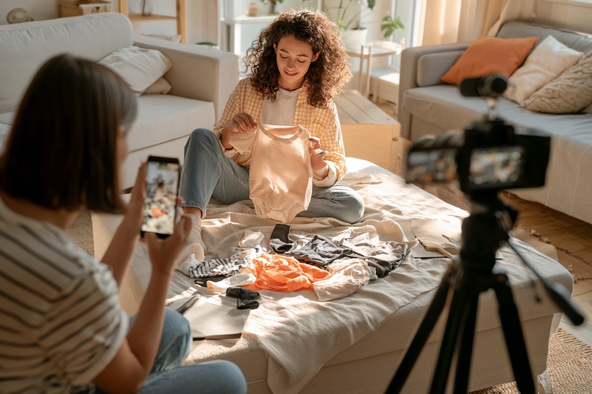 A mom blogger filming a flat lay of a kids underwear set at home, with soft morning light and a tidy living room background, product-focused with no child in frame