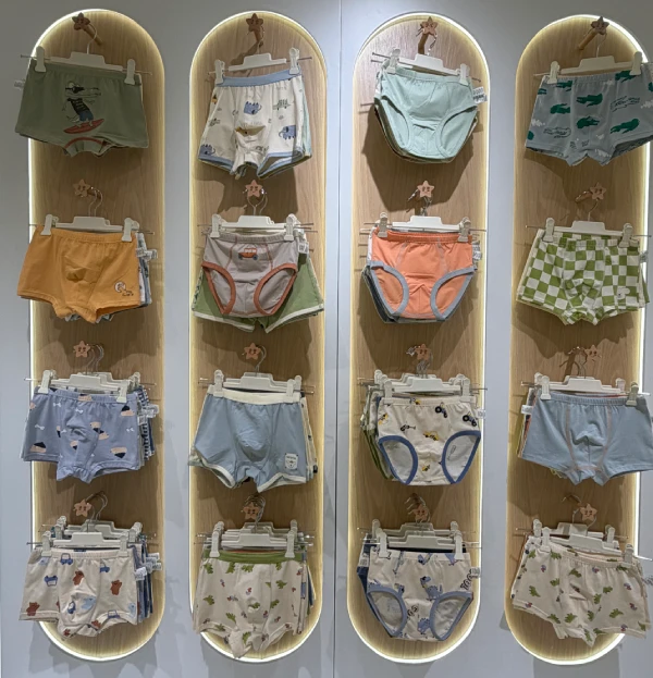 Baby and toddler apparel showroom with soft cotton tops pants and everyday clothing styles
