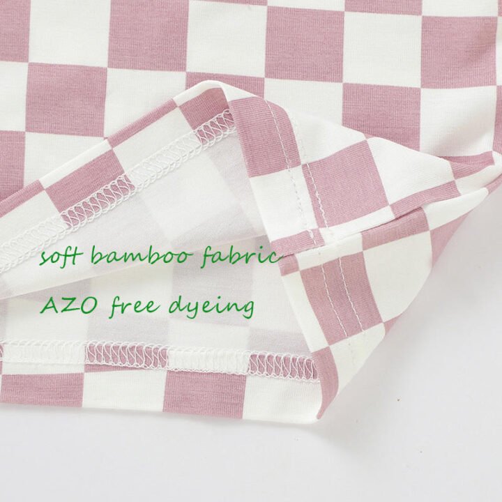 Close-up of checkered bamboo baby pajama fabric and internal seam construction