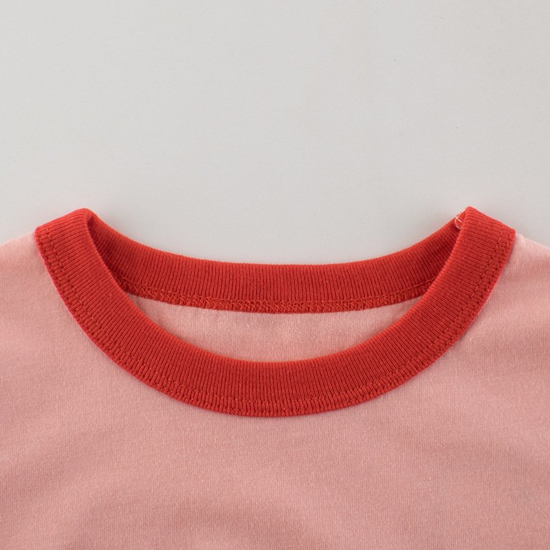 Close-up of red contrast ribbed crew neckline on girls cotton cherry t-shirt