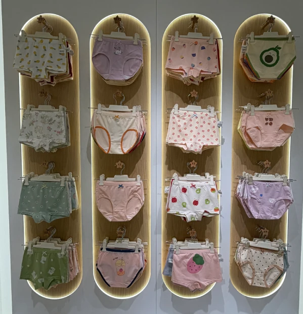 Girls cotton underwear display with briefs and boxer-style shorts in assorted prints and colors