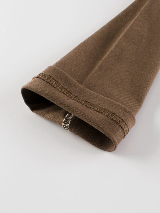 Inner stitching quality detail on the sleeve cuff of a kids blank long sleeve t-shirt