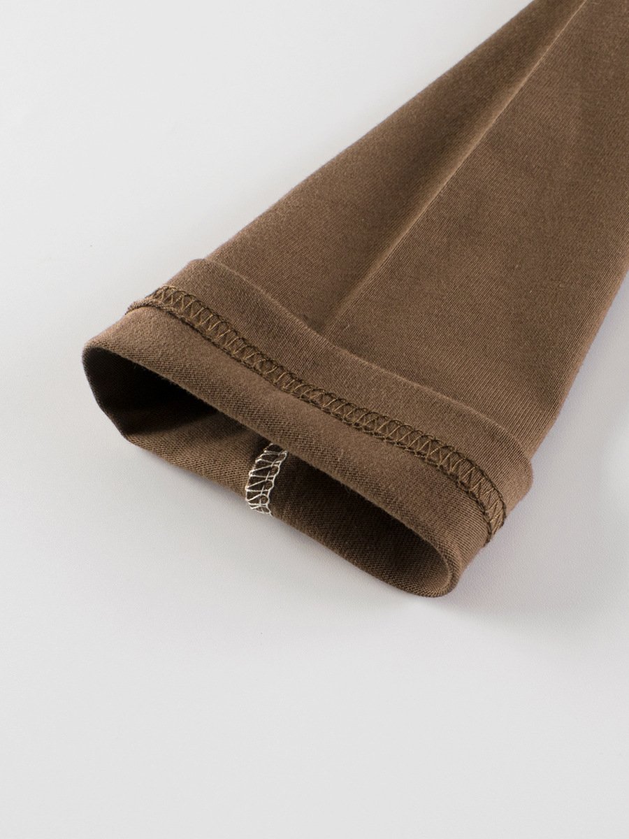 Inner stitching quality detail on the sleeve cuff of a kids blank long sleeve t-shirt