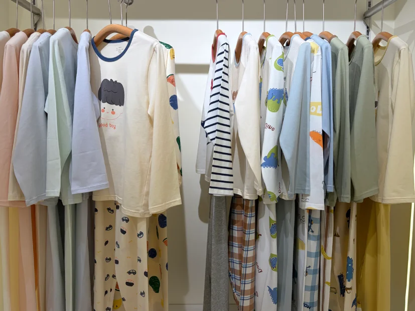 Kids sleepwear showroom displaying cotton pajama sets tops and printed loungewear styles
