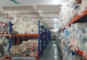 Fabric and trim procurement in the raw material warehouse