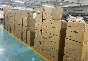 Packed kidswear cartons staged in the warehouse ready for shipment