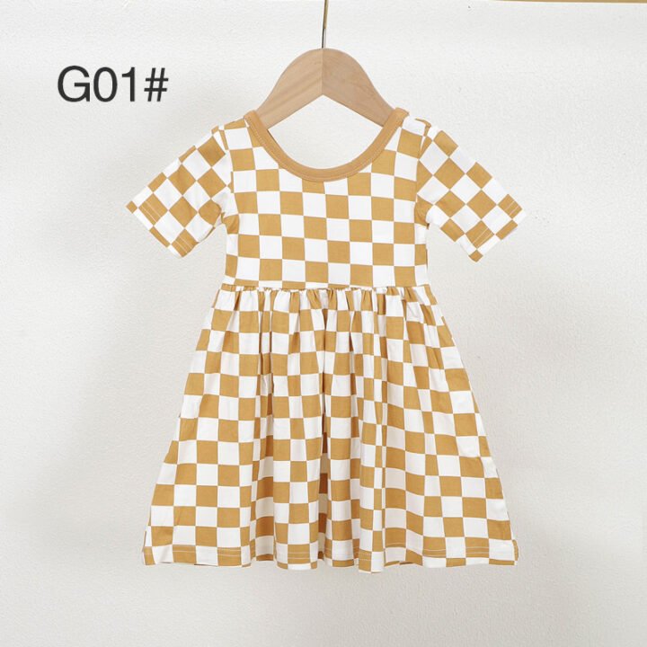 Mustard and white checkered bamboo viscose girls dress G01 displayed on a wooden hanger