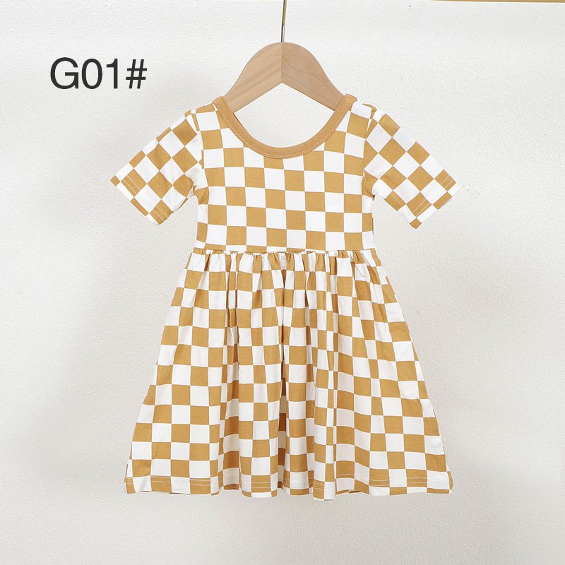 Mustard and white checkered bamboo viscose girls dress G01 displayed on a wooden hanger