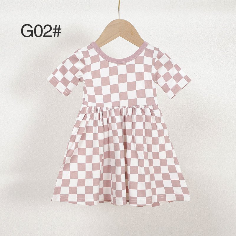 Pink and white checkered bamboo viscose girls dress G02 displayed on a wooden hanger