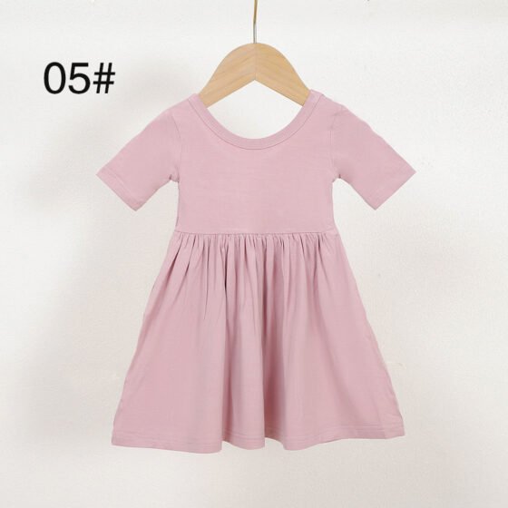 Pink short sleeve bamboo viscose girls dress color 05 displayed on a wooden hanger