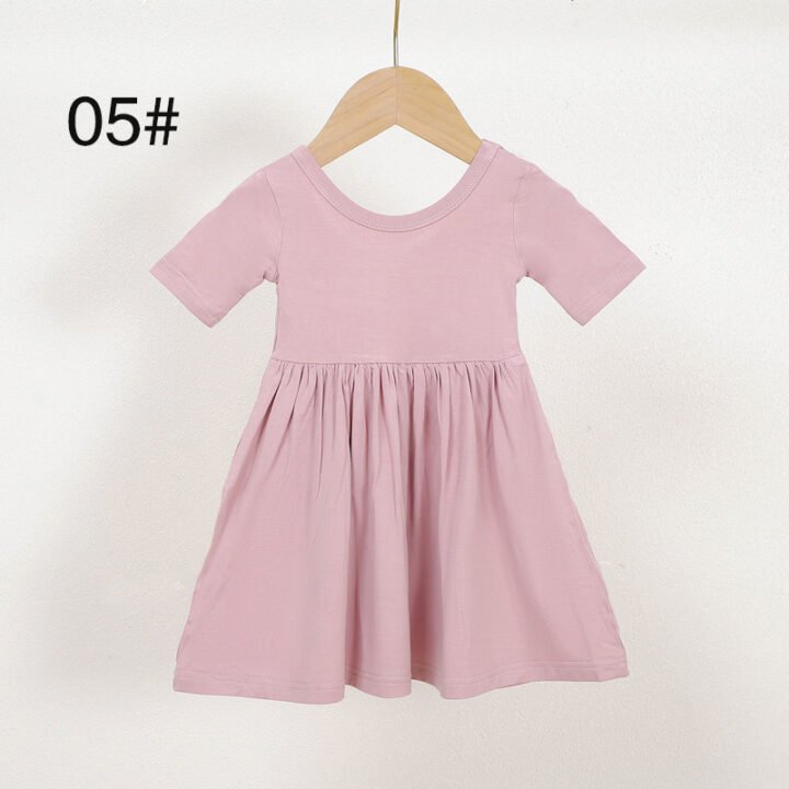 Pink short sleeve bamboo viscose girls dress color 05 displayed on a wooden hanger