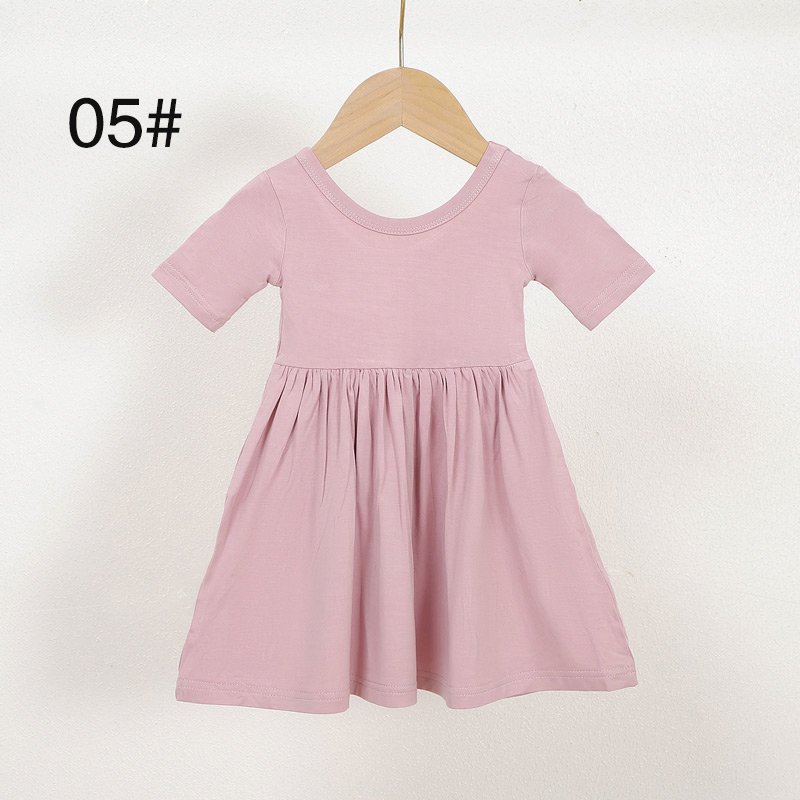Pink short sleeve bamboo viscose girls dress color 05 displayed on a wooden hanger