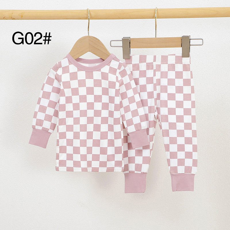 Pink and white checkered bamboo baby pajamas set with long sleeves and matching pants